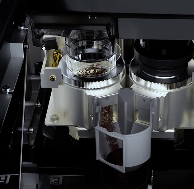 CAYE-SMART-X-Series Close-up of a microscope with a clear lens and metallic components on a dark background