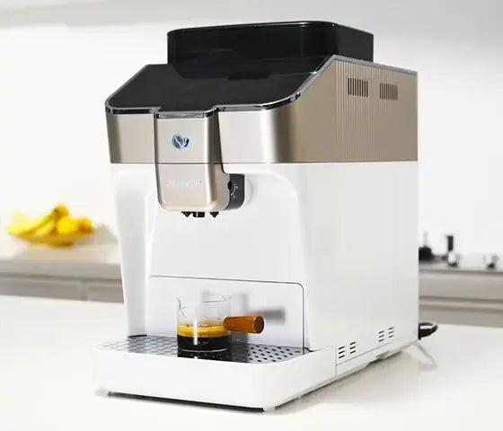 JETINNO JL03 PRO B White coffee machine dispensing coffee on a kitchen counter.