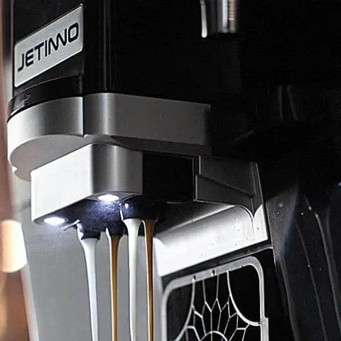 JL32 Close-up of a coffee machine with 'JETINNO' branding, showing coffee being dispensed. - Sip N Smile